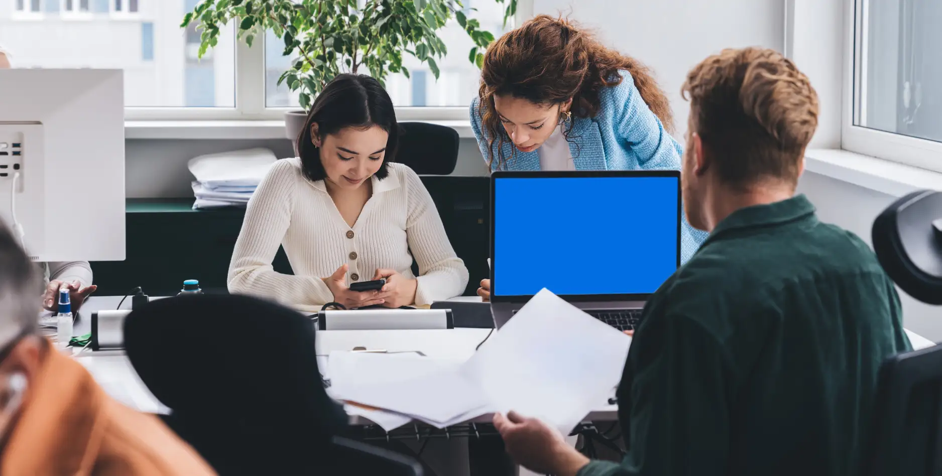 group-of-coworkers-sitting-at-workplace-with-compu-2025-03-25-22-33-11-utc-1