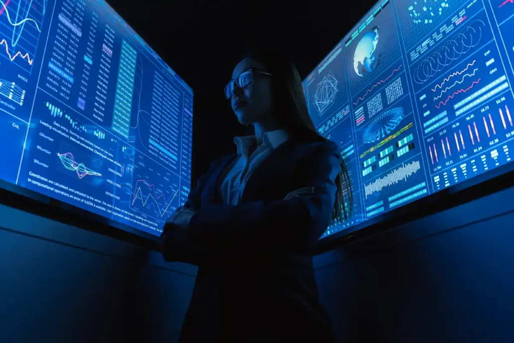 the-businesswoman-standing-near-the-blue-monitor